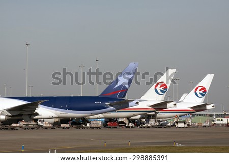 AMSTERDAM, THE NETHERLANDS - FEBRUARY 18, 2015:  Parked Boeing 777 cargo aircraft ready for a commercial cargo flight to their destination on february 18 , 2015 in Amsterdam (Schiphol ), Holland.