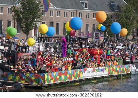 AMSTERDAM - AUGUST 1: Boat with lesbians and gays on a beautiful boat with colored balloons and cheerful clothed people on August 1, 2015 in Amsterdam, The Netherlands.