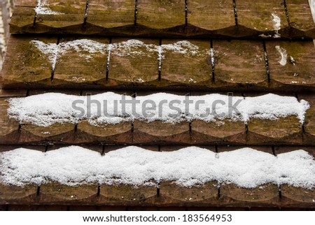 old wooden roof with snow