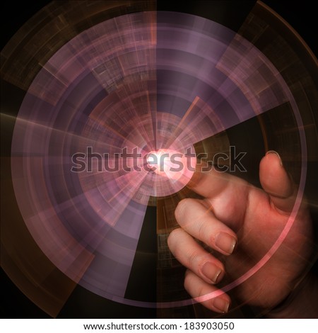 Hand pointing behind shiny circle on black background, as a concept metaphor of technology, science, and business innovations