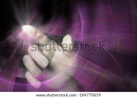 Hand pointing behind shiny circles on black background, as a concept metaphor of technology, science, and business innovations