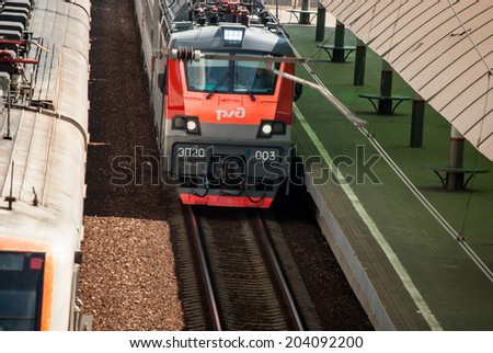 MOSCOW - JULY 9: Russian Railways electric train in Ramenskoye - suburb of Moscow on July 9, 2014. Route Golutvin - Ramenskoye - Moscow.