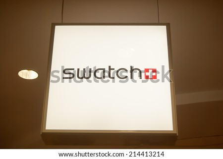 MOSCOW - AUGUST 11: Swatch logo in Okhotnyy Ryad shopping center near Red Square, Moscow, Russia, 11 August, 2014. Swatch group is a profitable watch manufacturer.