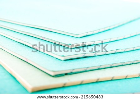 Stack of notebooks isolated on white
