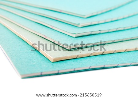 Stack of notebooks isolated on white