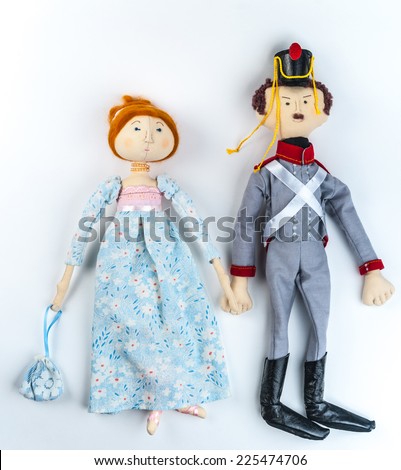 Textile toys. Couple of dolls in historic costumes of Napoleon era. Soldier and woman in gown.
