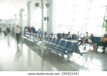 Blurred photo of an airport terminal. Blurred background for topics of Industrial architecture and transportation.