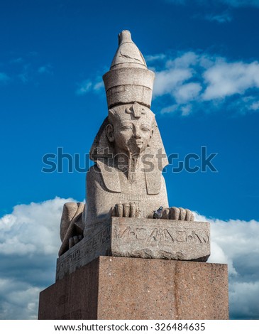 Authentic antique Egyptian sphynx on quay of the Neva river against cloudy sky in Saint-Petersburg, Russia. One of the prominent landmarks in Saint Petersburg.