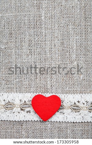wooden hearts and vintage ribbon on linen cloth