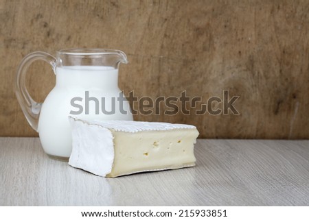 camembert cheese slice, milk jug and egg, dairy products