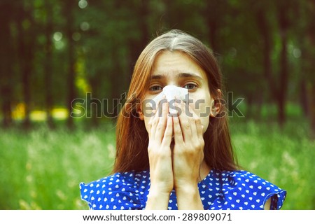 young woman suffering spring pollen allergy