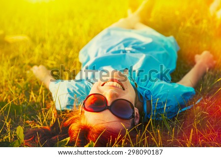 happy and smiling woman relaxing outdoors