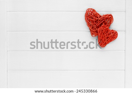 Couple of love red pedig rattan hearts on wooden light background - valentines - mothers day - fathers day - wedding invitation - card - space for text