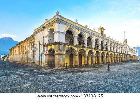 Large yellow and white Baroque style building in Antigua, guatemala.  Located in the main square of Antigua\'s old town.