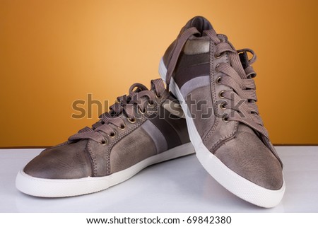 Brand new leather casual shoes. Studio shot. Artistic selective focus.