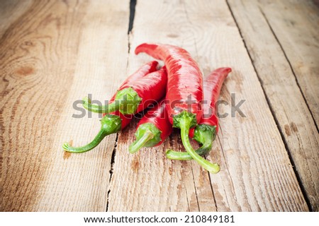 Juicy and spicy peppers on a wooden rustic table