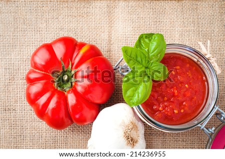 Tomatoes and tomato sauce, tomato puree on a wooden rustic table
