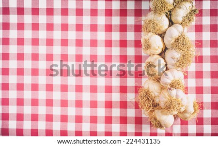 Garlic on red and white background