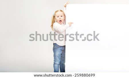 Beautiful little girl with white copy space on a white background