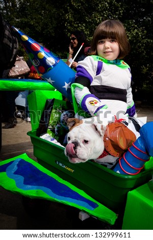 NEW YORK, NY - OCTOBER 24, 2010: An unidentified girl and her dog dressed as characters from the movie Toy Story attend the Tompkins Square Halloween Dog Parade. The event included a costume contest.