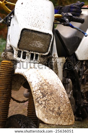 motocross motorcycle covered in mud
