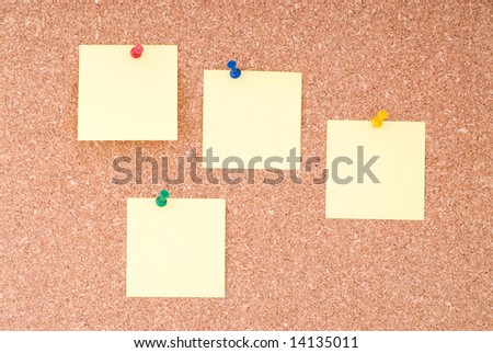 Yellow Note Papers With Tacks On Cork Surface