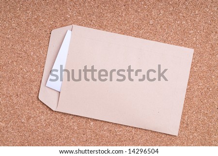Open Envelope with paper on cork background