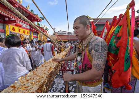 PHUKET - OCTOBER 14: an unidentified Chinese monk a Perform a ceremony Set The sacred wood poles is the symbol of the beginning Phuket Vegetarian Festival October 14, 2012 in Phuket, Thailand.