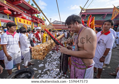 PHUKET - OCTOBER 14: an unidentified Chinese monk a Perform a ceremony Set The sacred wood poles is the symbol of the beginning Phuket Vegetarian Festival October 14, 2012 in Phuket, Thailand.