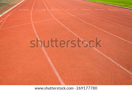 Red running tracks in sport stadium