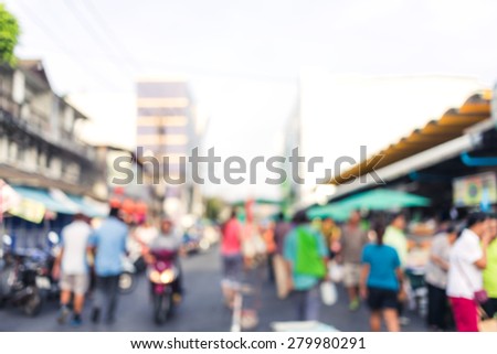 A crowd of people moving on the old town city street defocused blurred abstract image at phuket thailand