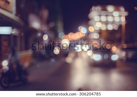 A crowd of people moving on the old town city night street defocused blurred abstract image at phuket thailand