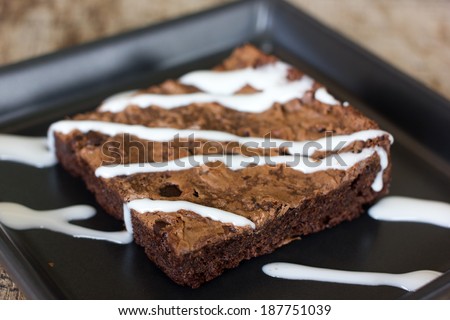 Brownies or cake bars covered in white chocolate.