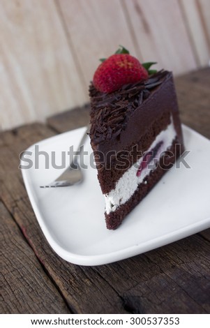 Black forest cake. Chocolate cake topped with a strawberry,