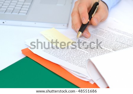 Businessman is correcting a contract
