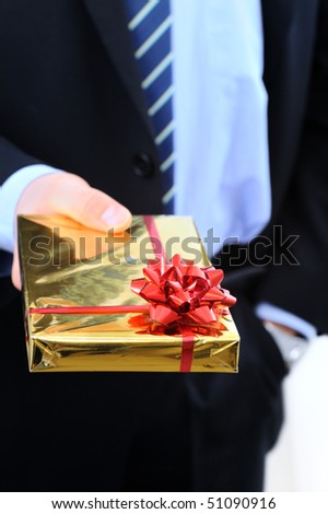 Businessman is giving a present to you