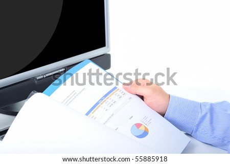Businessman is checking an annual report