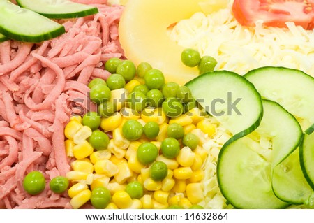 Fresh salad with ham, corn, peas, cucumber, cheese, tomato and pineapple