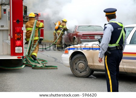 firemen with burning car