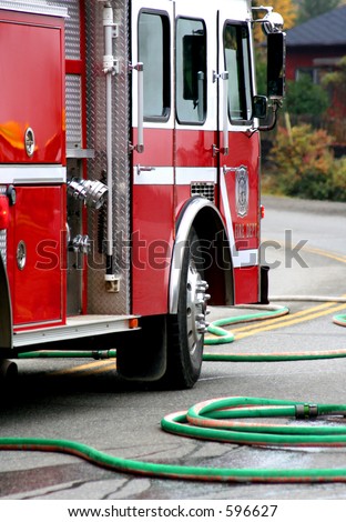 firemen with burning car