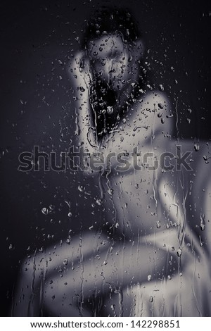 woman through rainy window