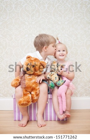 brother kissing little sister