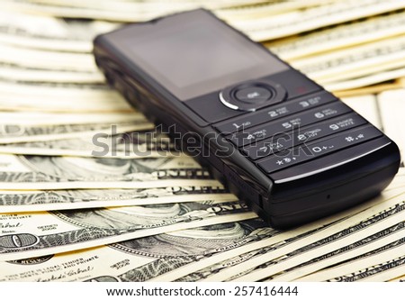 mobile phone on the money background
