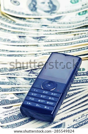mobile phone on the money background