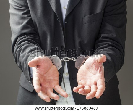 corporate man in bracelets begging for freedom