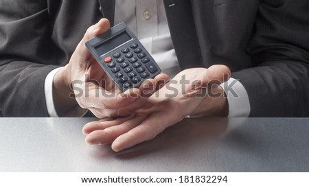 male manager displaying symbol of cost savings