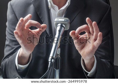 businessman body language facing a public