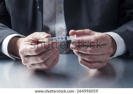 healthcare professional with needle symbol of treatment in hands