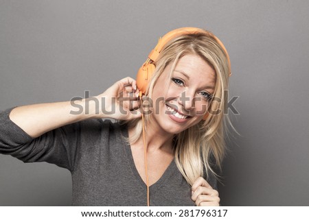 pretty young woman enjoying good vibes on earphone