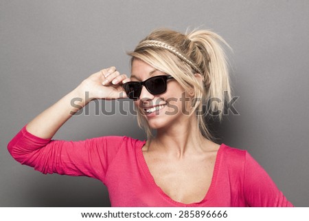 gorgeous blonde woman wearing sunglasses like a star